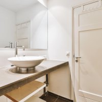 Sink in modern bathroom at home
